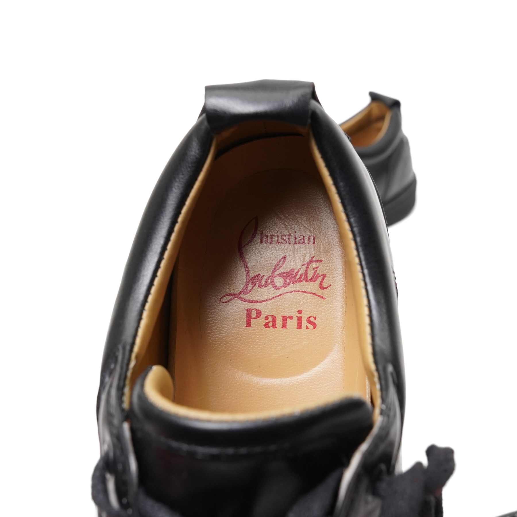 Christian Louboutin and Burberry - two pairs of designer shoes, comprising black leather Christian Louboutin low-top sneakers with black spike-studded toe caps and signature red soles, size 40, with dust bag, together with Burberry check canvas and red transparent strap sandals, size 39, with box and dust bag (2)