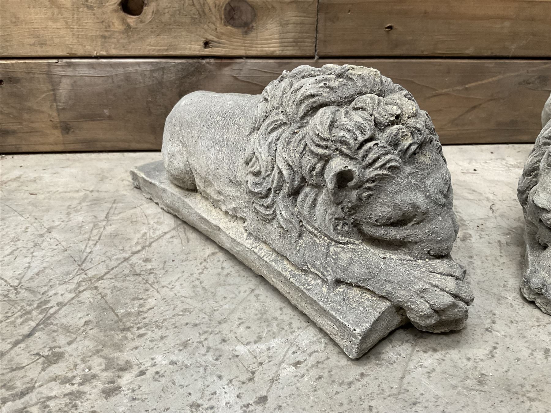 Pair of small cast stone sleeping Trafalgar Lions
