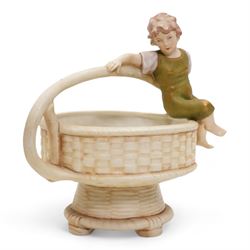 Royal Dux figural basket, modelled with a boy sitting upon the rim, H20cm, a Royal Dux figural trinket dish and a figural jug (3)