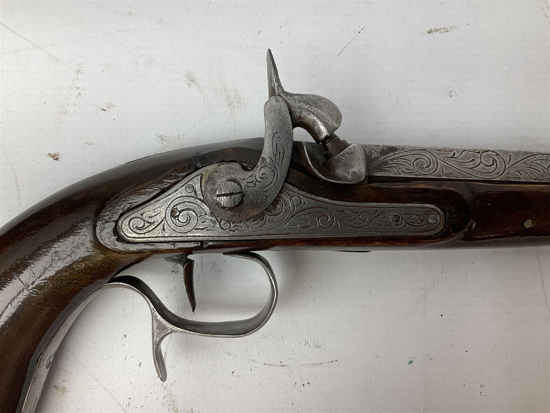 SECTION 1 FIREARMS CERTIFICATE REQUIRED OR REGISTERED FIREARMS DEALER - Pair of Reproduction Continental .44 calibre percussion target pistols, each with heavy 23.5cm octagonal to round barrel bearing various marks, crude scroll engraving to lock plate, hammer and octagonal section of barrel, unchequered walnut stock with brass butt plate and steel hooked trigger guard, numbered 8138 & 8164, L41.5cm overall; in maroon baize lined converted sapele mahogany fitted case bearing reproduction trade label for Trulock & Son Dublin containing small copper powder flask, steel scissor action bullet mould, nipple key, turned wooden mallet and lidded box, steel rammer and wooden cleaning rod, case L48cm