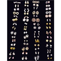 Sixty pairs of stud earrings including bow, flower, star and heart designs 