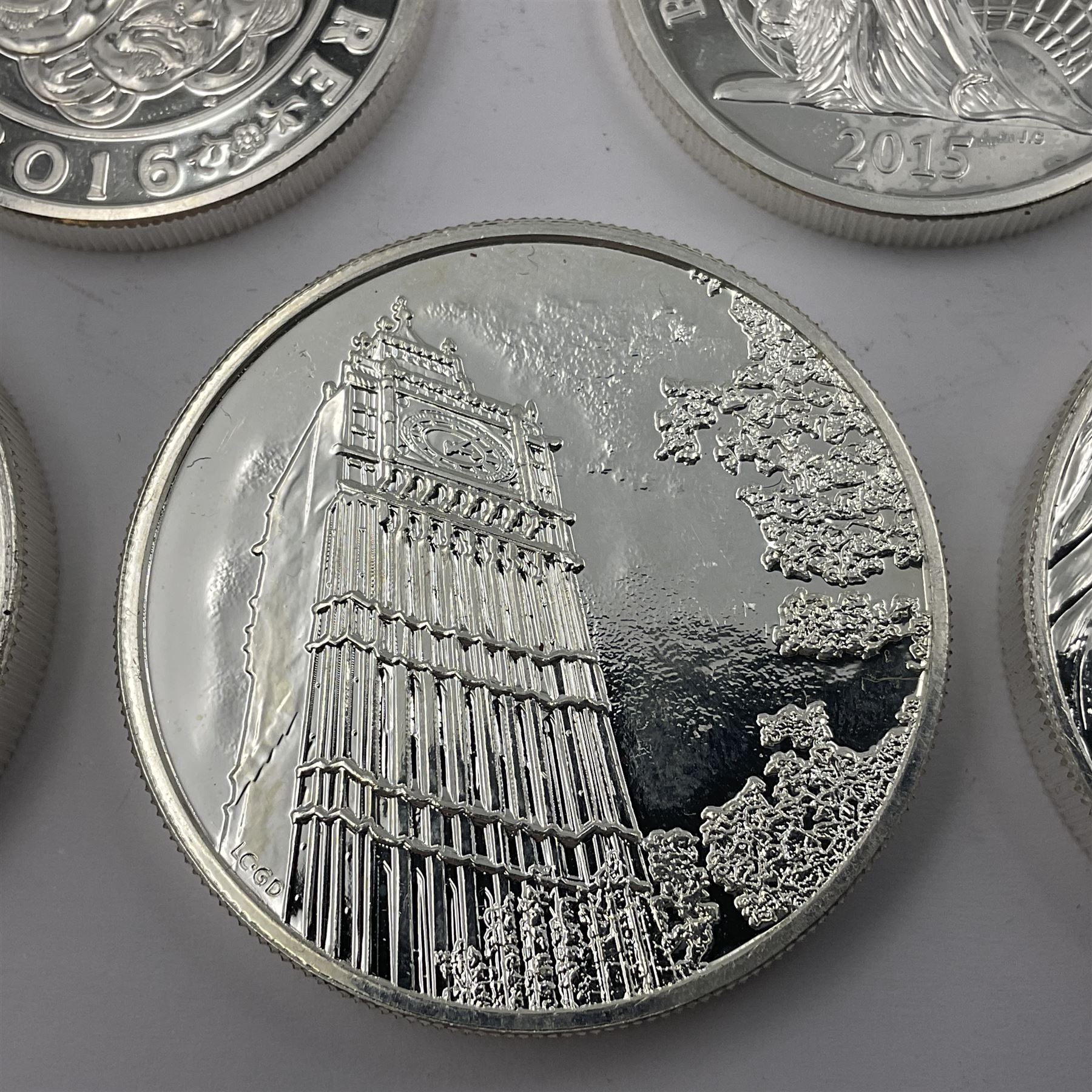 Five The Royal Mint United Kingdom fine silver coins comprising 2015 ‘Buckingham Palace’, 2016 ‘Big Ben’ and 2016 ‘Trafalgar Square’ one hundred pound coins, with 2015 ‘Britannia’ and 2016 ‘The Shakespeare Histories’ fifty pound coins