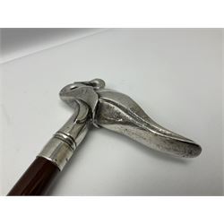 Art Deco style Italian 'Rivestito' covered silver walking stick handle, modelled in the form of a swan, stamped 'R', upon a silver collar hallmarked Birmingham 1986, makers mark DH-L, and hardwood shaft, L96cm

Provenance by vendor repute: 
This walking cane comes from a private collection amassed by the current vendors mother who was an Antique dealer specialising in walking sticks, working at the Portobello Road Antique Market in London for over forty years. 
In 1988 the prop crew from LWT (now ITV) visited Portobello Road looking for, amongst other items, a signature stick for David Suchet to use in his portrayal of Agatha Christie's Poirot. 
At the time this particular walking stick was one of five in possession. The prop crew chose and purchased another of the five which was then used by Suchet throughout all seventy episodes of the much loved series. 
Following the conclusion of the series Suchet was gifted his particular cane, which has been loaned to and can now be seen at the Agatha Christie Gallery at the Torquay Museum. 
