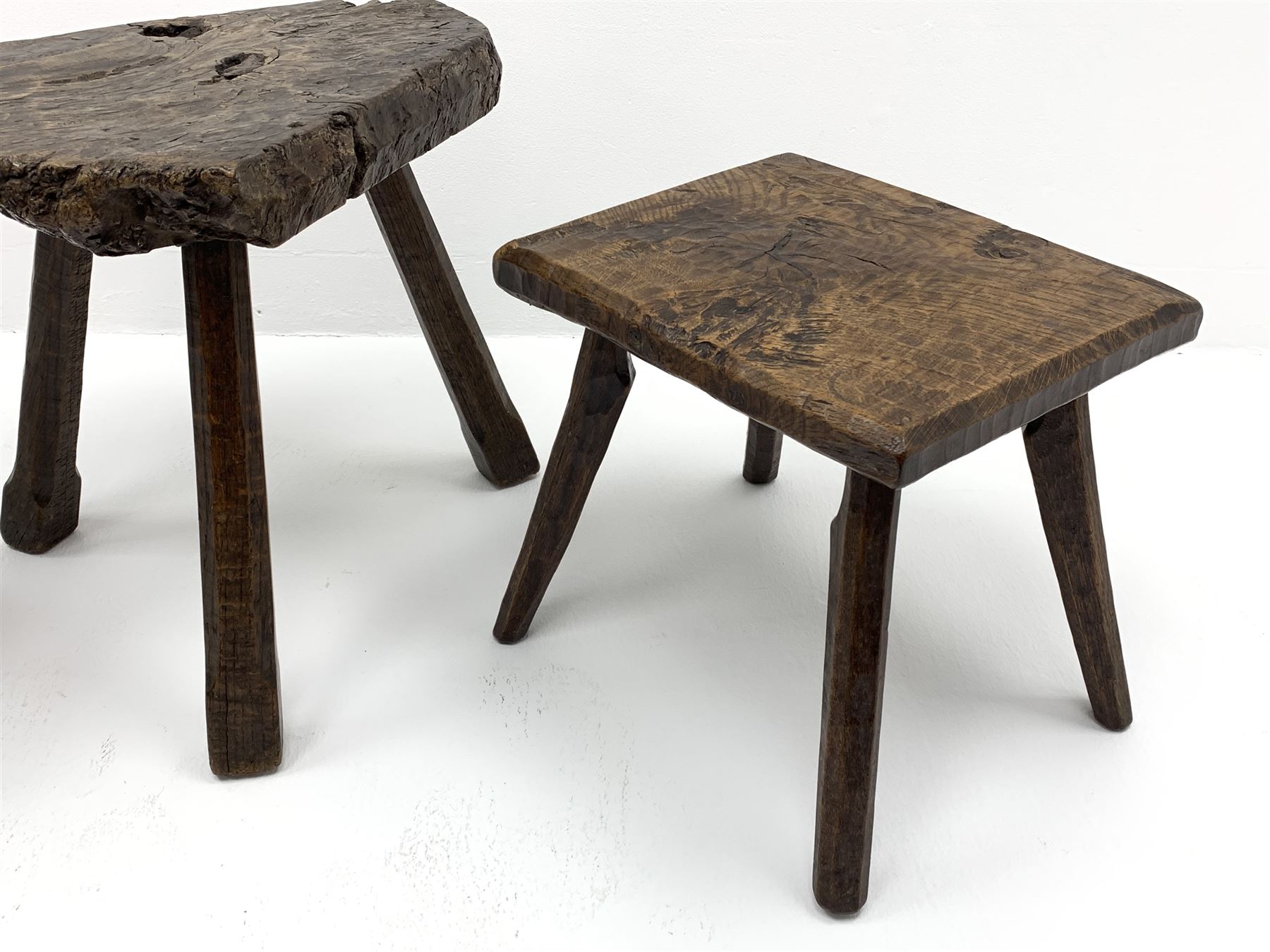 Collection of three mid 20th century stools by Jack Grimble of Cromer - rectangular tooled oak seat on four splayed supports (38cm x 31cm, H35cm), circular tooled burr oak seat on three supports (D29cm, H35cm), shaped burr top on three supports (L44cm, H45cm), each signed underneath