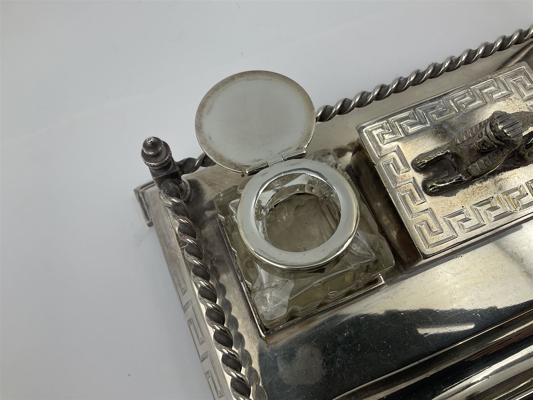 Egyptian Revival style desk stand, with pen tray and two glass inkwells, upon four bracket feet, W23cm