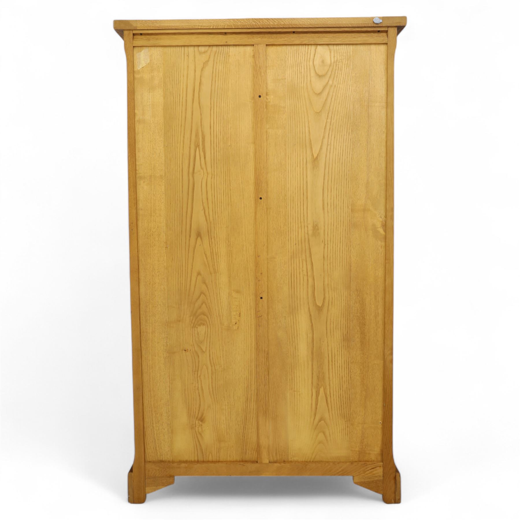 Old Charm - 'Chatsworth' light oak bookcase with two cupboards, featuring two fixed horizontal shelves forming six  rectangular open compartments, over twin panelled cupboard doors, chamfered uprights and plinth base