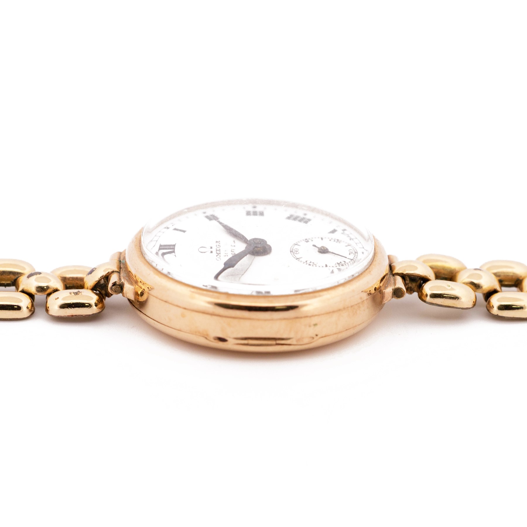 Omega early 20th century 9ct gold manual wind wristwatch, white enamel dial with subsidiary seconds dial, case by Dennison, Birmingham 1927, on a gold-plated strap and an Americ 14ct gold manual wind wristwatch, stamped 14K