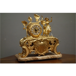  Late 20th century gilt metal figural mantel clock, decorated with scrolls and shell motifs, on serpentine moulded plinth, W38cm  