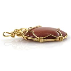 9ct gold wire goldstone pendant