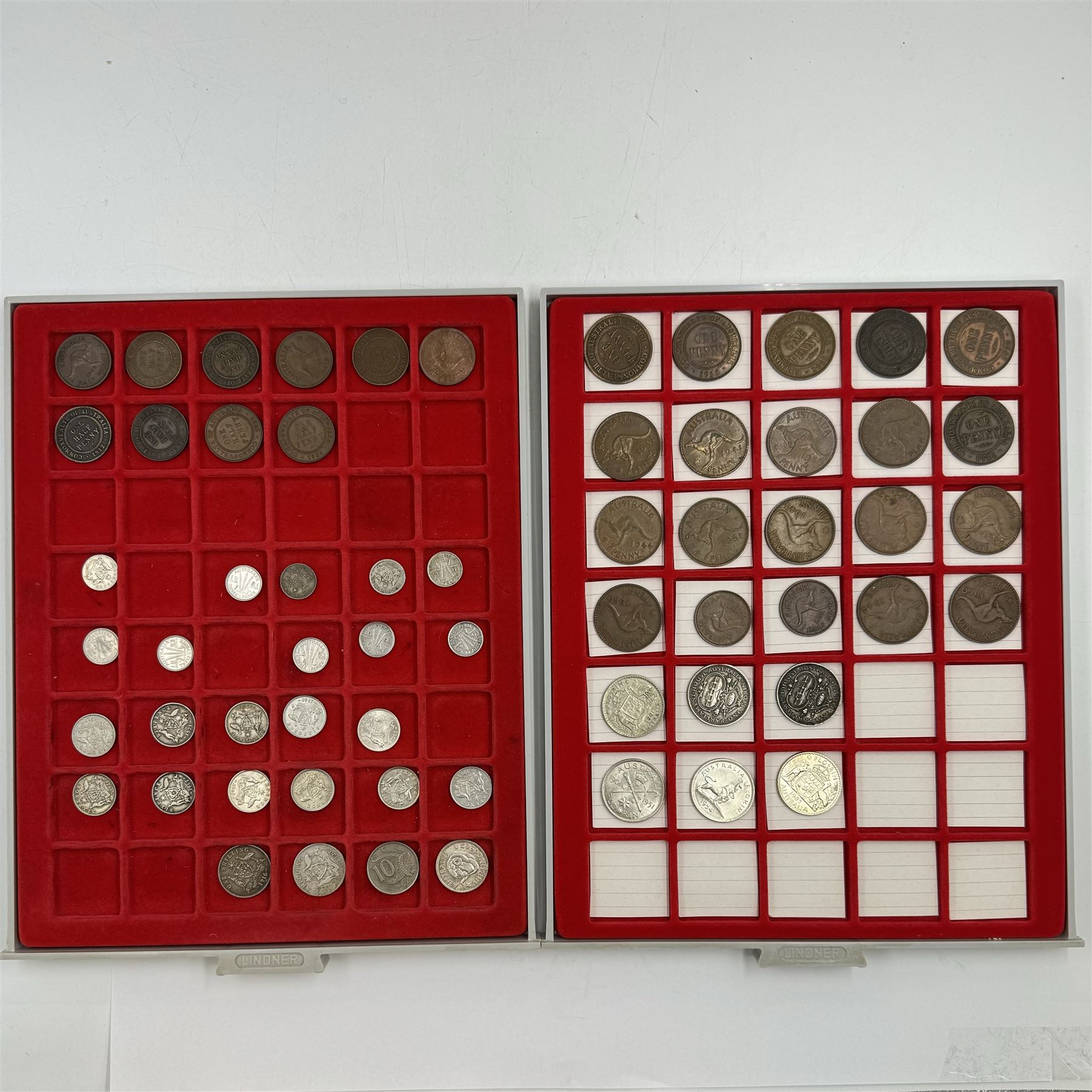 Australian coinage, including two King George V 1927 'Parliament House' one florins, various sixpences, Queen Elizabeth 1961 and other threepence pies, pennies etc, housed in two Lindner coin trays