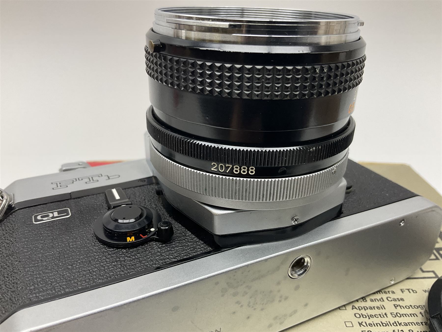 Canon FTb camera body, serial no. 715838, with 'Canon FD 50mm 1:1.8' lens, serial no. 207888, in original box, together with Canon FTb camera body, serial no. 557817, with 'Canon FD 35mm 1:3.5 S.C' lens, serial no. 126210 and Canon EX Auto camera body, serial no. 296244 with 'Canon EX 50mm 1:1.8' lens, serial no. 380869  