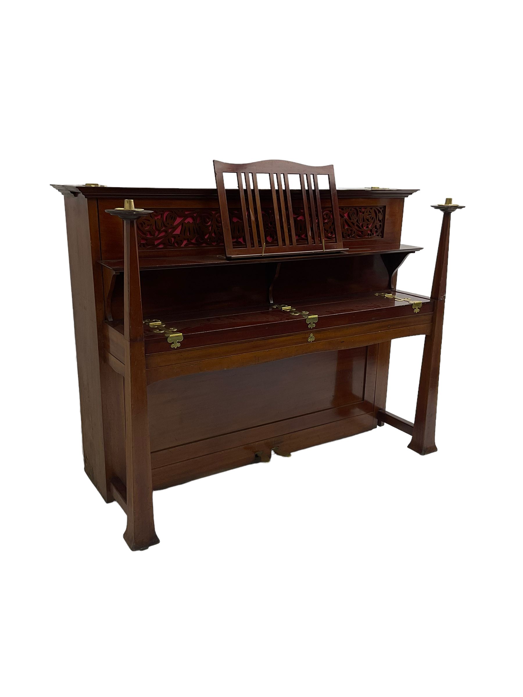Carl Bechstein - late 19th century German overstrung upright piano, in a model 4 Arts and Crafts case designed by Walter Cave, with a lattice music desk and fretted silk backed front panel, brass hinged case lid and key fall with square tapered candle holders and circular sconces, iron frame, serial number 52187 (1899-1900), with an under damper action, 85 ebony and ivory keys, sustain and una corda pedals, original action, stringing, dampers, and action return straps, registered case number 328639, USA patent 24805.

This item has been registered for sale under Section 10 of the APHA Ivory Act