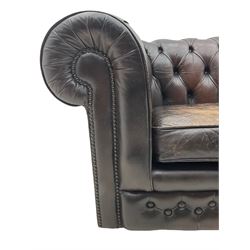 Chesterfield two seat sofa, upholstered in distressed brown buttoned back leather