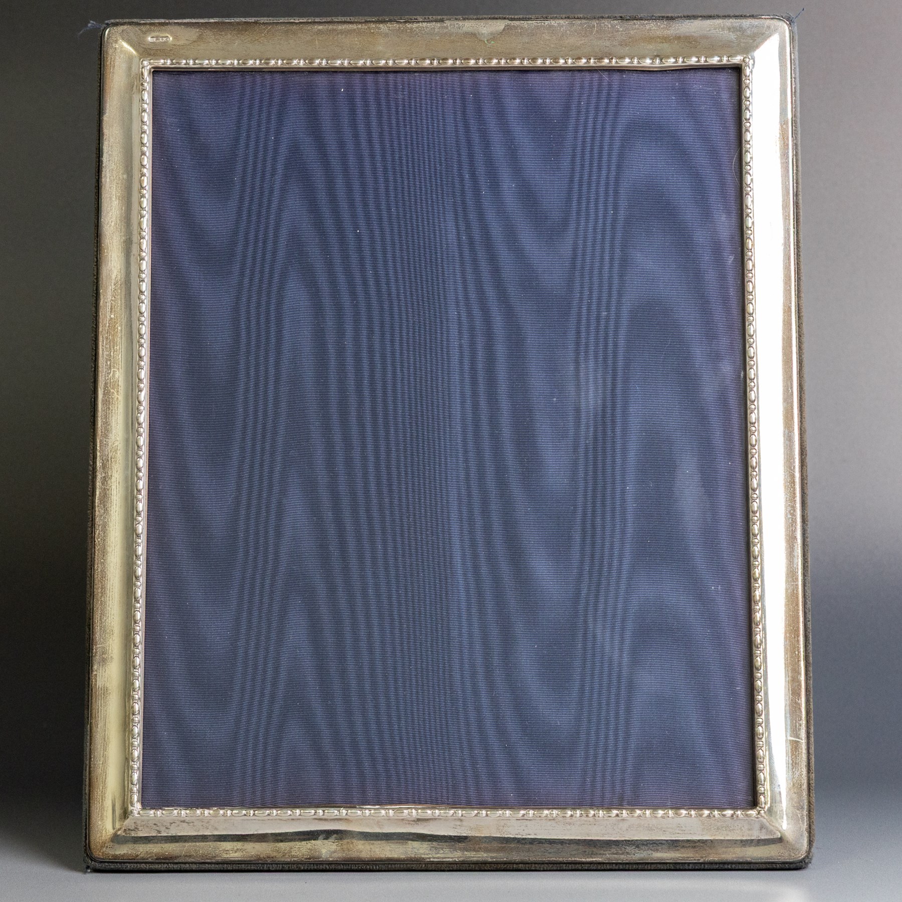 Late 20th century silver photograph frame, rectangular with beaded decoration to inner edge, blue velvet easel style support verso, hallmarked Carrs of Sheffield Ltd, Sheffield 1995