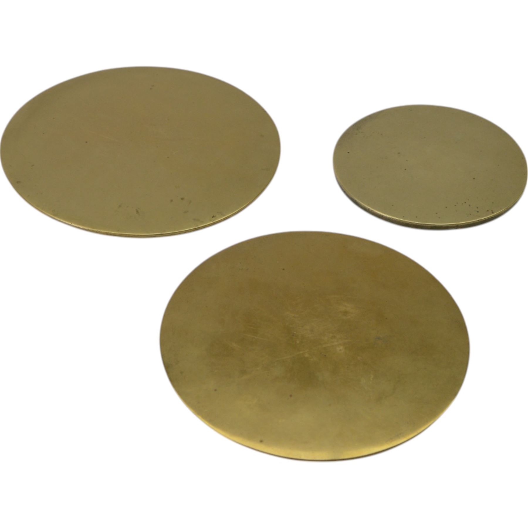 Three Chinese bronze hand mirrors, the smallest decorated in relief with four characters, largest D19cm