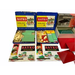 Bayko - quantity of building sections, graduated roofs etc, loose and in boxes No.2x (Converting Set), two x No.11 (Building Set) and No.11c (Accessory Outfit); together with an unmade Playtown Bungalow building construction kit, boxed with instructions