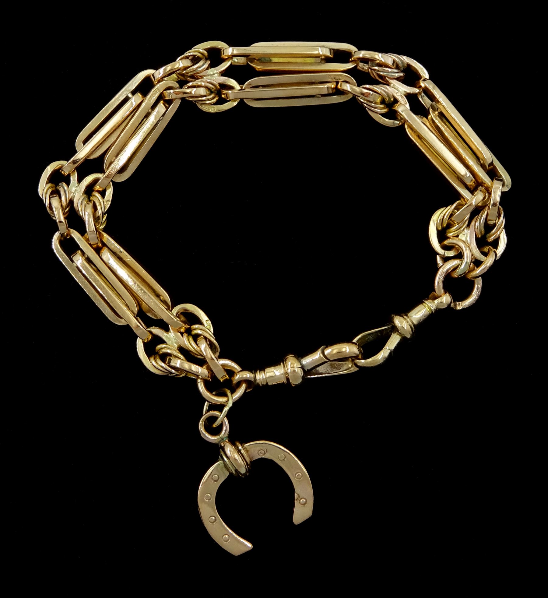 Early 20th century 9ct rose gold double rectangular link, bracelet, with two clips and horseshoe charm, each link stamped 9.375