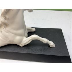 Five Beswick and Royal Doulton horse figures in matt white on black plinths, comprising of  Spirit of Affection no. 2689/2536, Springtime no.2837, Spirit of peace no.2916, Spirit of earth no.2914 and Spirit of the wild no. 183, together with a composite figure of a horse (6)