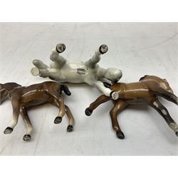Thirteen Beswick horse figures, to include Shetland Pony no. 1648, bay mare 1812, large bay foal no. f947, Shetland foal no. 1034 etc, all with printed or impressed mark beneath   