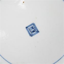 Pair of Japanese Edo period Ko Kutani dishes, decorated in green, yellow, blue iron-red, and aubergine enamels, the centres painted with a singing bird perched on a rock among foliage, within a border of alternating geometric designs and a chocolate-brown rim, the reverse with underglaze blue foliage, Fuku mark, D20.8cm (2) A matching pair of dishes is held in the collection of the Cleveland Museum of Art (see accession no. 1964.262)