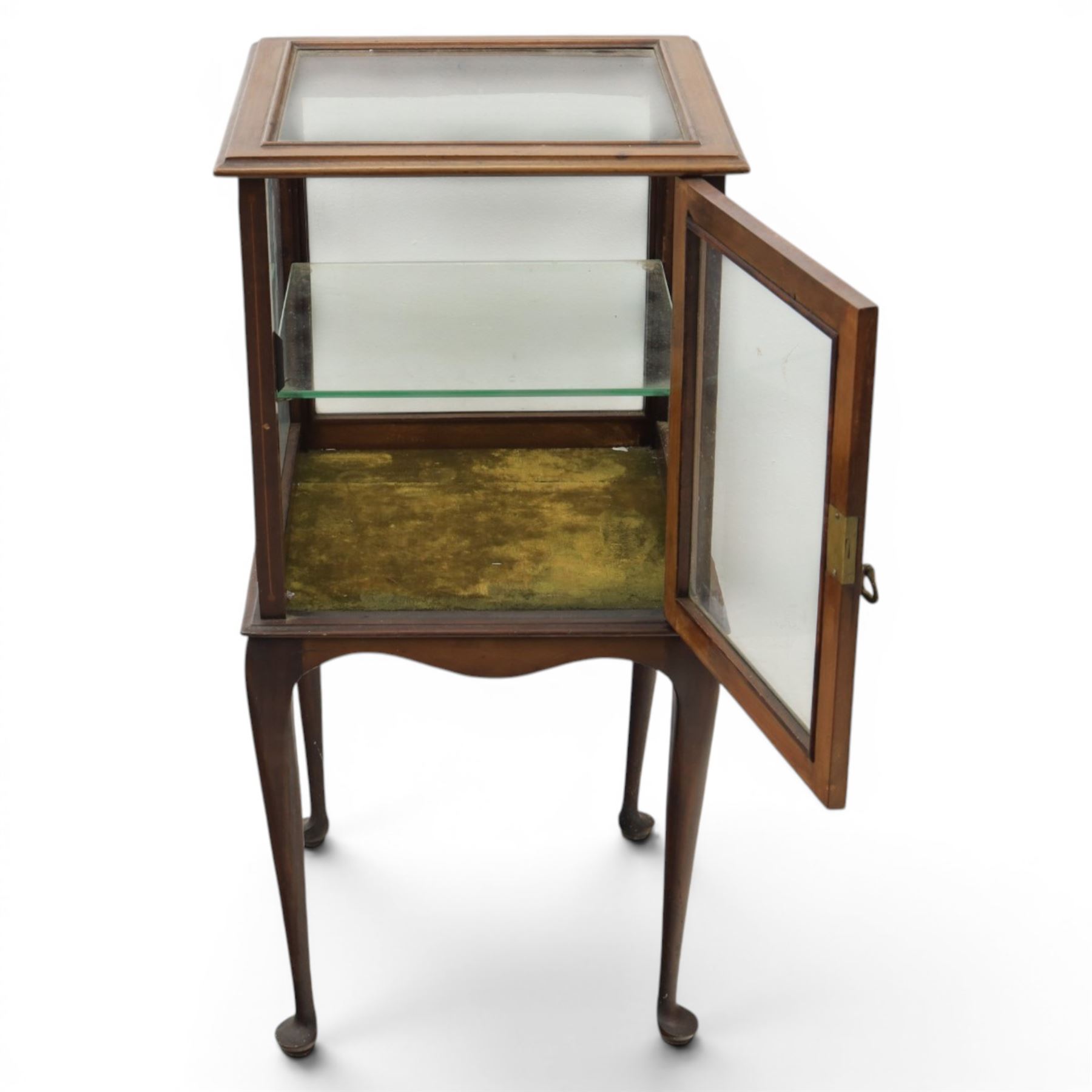 Edwardian bijouterie two tier table, glazed top and sides with inlay surround, glazed door enclosing a single shelf and baized lined interior, raised on cabriole supports