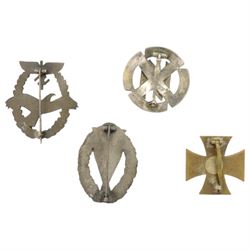Four German style badges, including Iron Cross, German Proficiency SS runes badge, etc together with a reproduction German cap 
