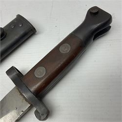 British Pattern 1888 knife bayonet, the 30.5cm double edged blade with raised central medial ridge; in leather covered scabbard L40.5cm overall