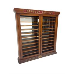 Modern hardwood display cabinet for model railway locomotives inscribed 'Gresley Pacifics' to the frieze and 'LNER' to the bottom rail; with mirrored back and ten loose fitting shelves enclosed by a pair of unglazed doors L101cm H108cm D16cm