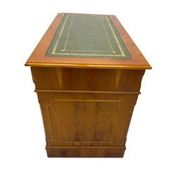 Yew wood twin pedestal office desk, fitted with nine drawers, inset leather writing surface