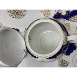 Shelley Empire pattern tea service for twelve, decorated with borders of electric blue and gilt foliate design on plain white ground, pattern no 14078, comprising fourteen saucers, fourteen tea plates, cake plate, twelve teacups, teapot, bowl and jug, all with printed marks beneath