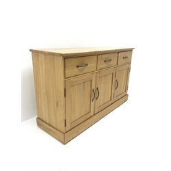 Light oak sideboard,  three drawers above three cupboards on plinth base, W137cm