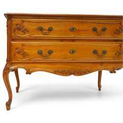 Early 20th century French fruitwood commode chest, rectangular top with moulded edge, fitted with two long drawers with moulded scroll and floral decoration, shaped apron with moulded scallop motif and trailing foliate, raised on cabriole legs with acanthus carved knees and scroll feet
