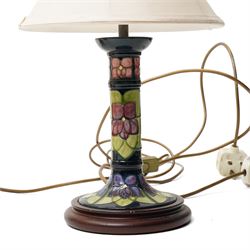 Three Moorcroft lamps in the Violet and Hibiscus patterns, two with shades, largest including shade H46 (3)
