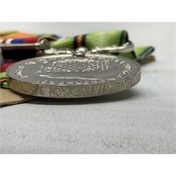 WW2 Royal Naval group of eight medals comprising OBE, hallmarked silver Distinguished Service Cross inscribed verso Lieut. J.R. McCluskie RNVR 1945, 1939-1945 Star, Atlantic Star, Africa Star, 1939-1945 War Medal, Defence Medal and Royal Naval Patrol Service Medal inscribed Lieutenant J.R. McCluskie Royal Naval Patrol Service; with seven original photographs of a sea battle 27th November 1940 against the Italian Fleet and another photographic postcard of Sir Stafford Cripps arriving on board one of the vessels.