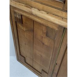 Large late 19th century sycamore corner cabinet, the top section with two astragal glazed doors enclosing two shaped shelves, the lower section enclosed by two panelled doors with square spandrels, W128cm, H215cm