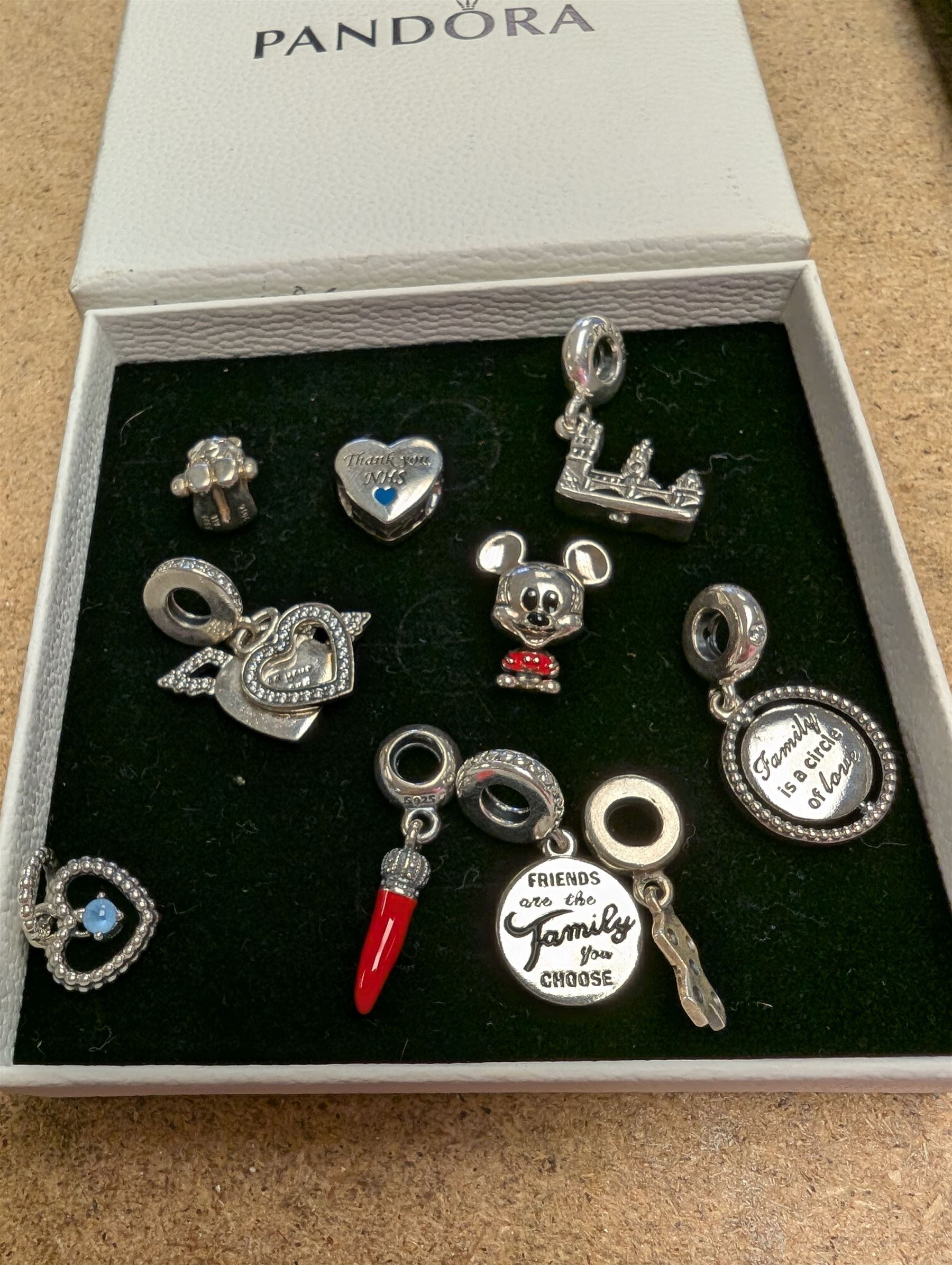 Ten silver Pandora charms, including Mickey Mouse, Pudsey Bear etc, all stamped S925 ALE, in one Pandora box