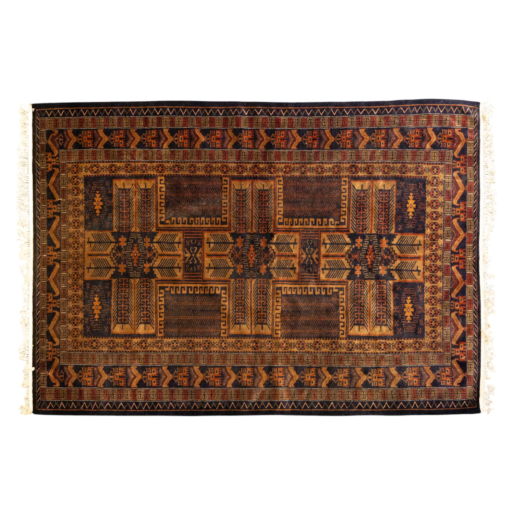 Baluch tribal style rug, dark indigo field with rows of linked gul and angular medallions in madder, camel, and ivory tones, within multiple geometric borders, including the main border of stylised animals