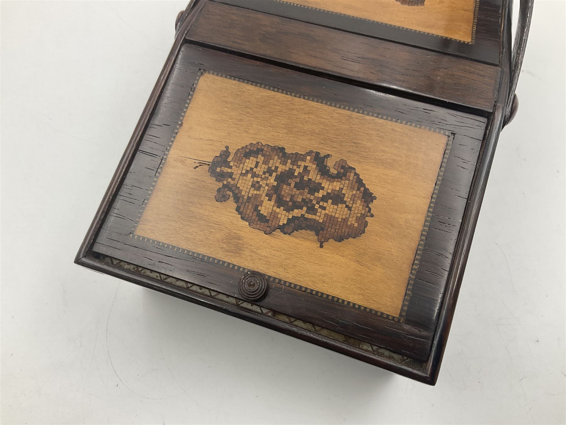 19th century rosewood Tunbridge Ware basket, of rectangular form with curved bentwood handle, and twin hinged sloping covers, lifting to reveal paper lined interiors, not including handle H5.5cm D10.5cm L18cm