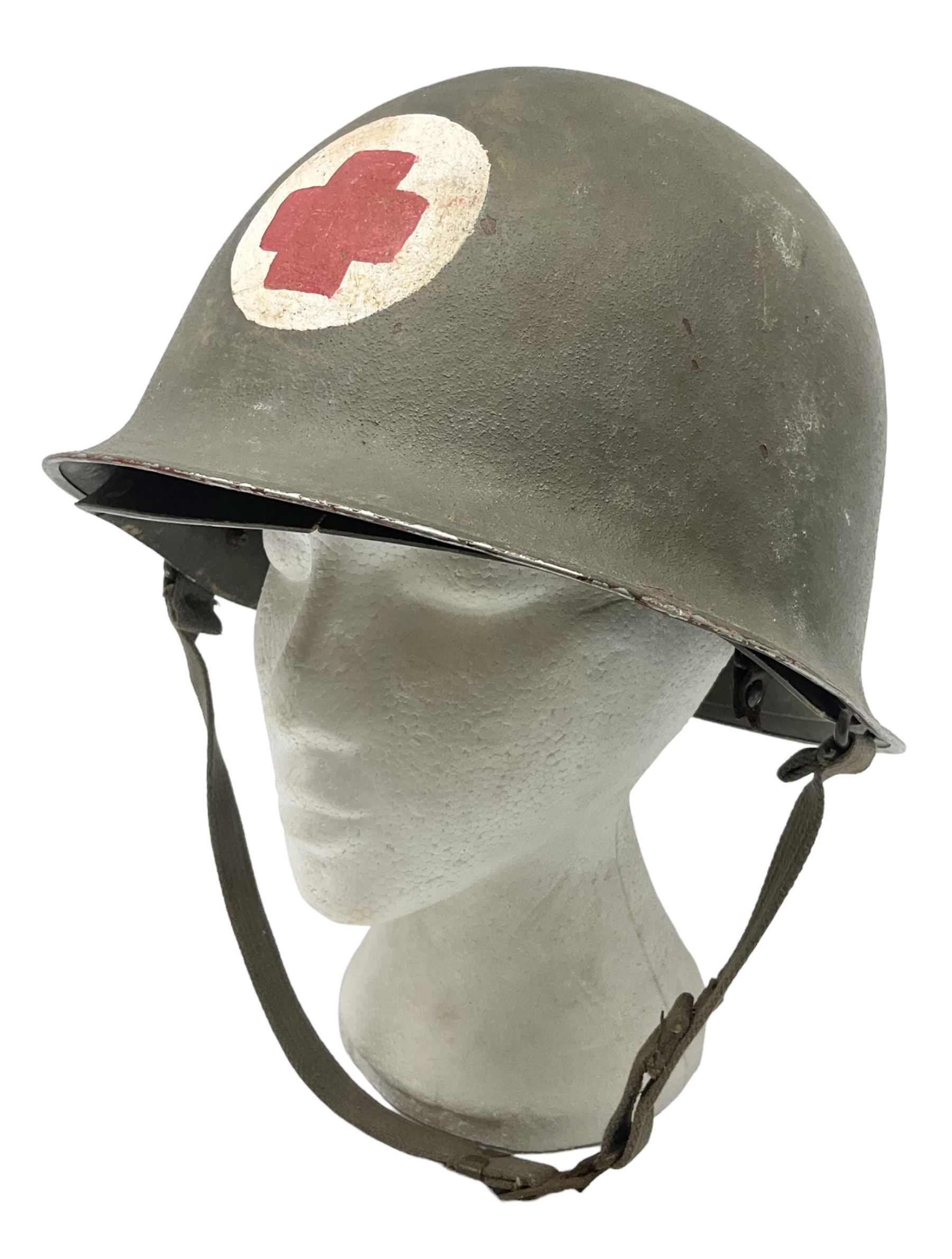 French Algerian War Red Cross steel helmet, marked 'CP ICA Esperaza 1955'; green finish with crudely painted Red Cross logo to the front