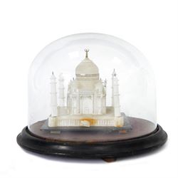 Early 20th century carved alabaster model of the Taj Mahal, early 20th century, under glass dome, raised on a velvet-lined and ebonised plinth, H26cm