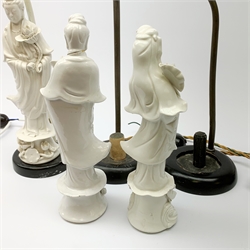 Three blanc de chine figures, modelled as Guanyin, each mounted upon a lamp base, (a/f), figures H26cm. 
