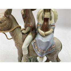 Lladro figure, A Ride in the Country, modelled as a young boy and girl riding upon a donkey, sculpted by José Puche, no 5354, year issued 1986, year retired 1994, H20cm