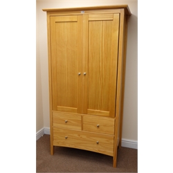   Pine double wardrobe, two doors enclosing hanging rail, two short and one long drawer, stile supports, W96cm, H188cm, D55cm  
