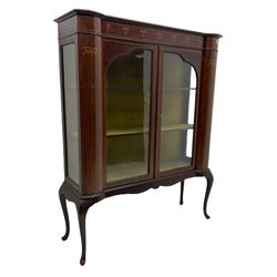 Edwardian mahogany display cabinet, shaped front with painted ribbon and bellflower garland decoration, enclosed by two glazed doors, cabriole supports