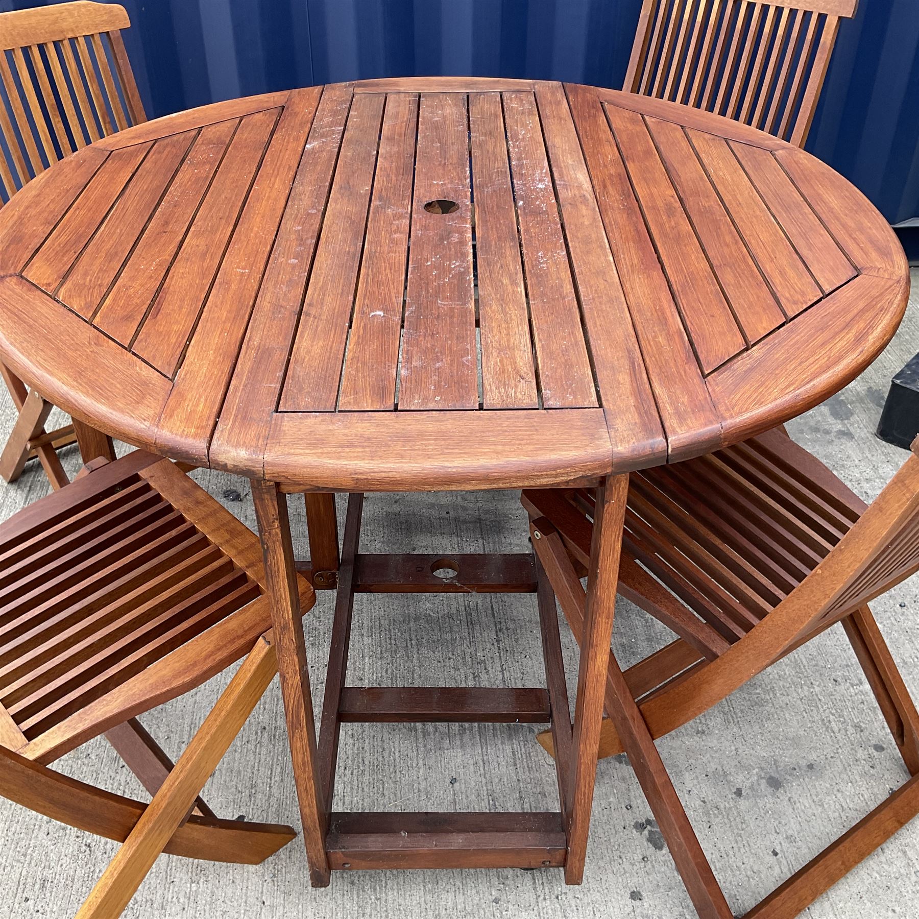 Hardwood drop leaf garden table on castors and folding chairs - THIS LOT IS TO BE COLLECTED BY APPOINTMENT FROM DUGGLEBY STORAGE, GREAT HILL, EASTFIELD, SCARBOROUGH, YO11 3TX