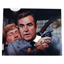 Collection of James Bond related signed film stills and promotional photographs, including Sean Connery and Pierce Brosnan promotional shots, Desmond Llewelyn, Octopussy poster, John Glenn, Blanche Ravalel, Geoffrey Holder and Julian Glover, all with certificates of authenticity
