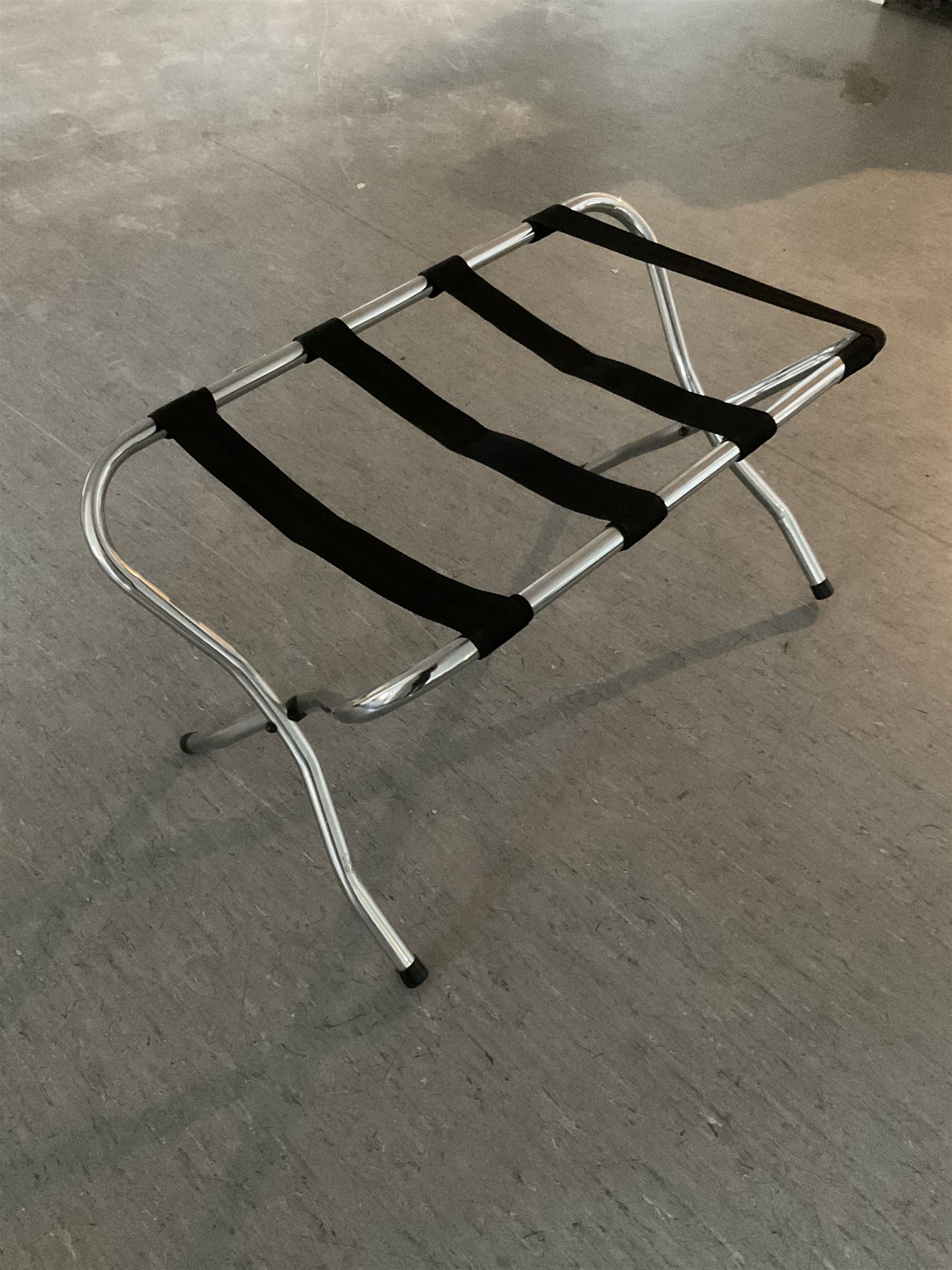 Sixteen folding luggage stands (16)- LOT SUBJECT TO VAT ON THE HAMMER PRICE - To be collected by appointment from The Ambassador Hotel, 36-38 Esplanade, Scarborough YO11 2AY. ALL GOODS MUST BE REMOVED BY WEDNESDAY 15TH JUNE.