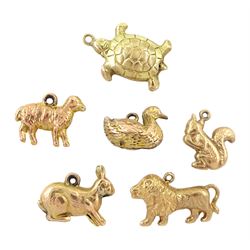 Six 9ct gold pendant / charms including duck, turtle, lion, rabbit, squirrel and sheep