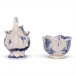 Derby blue and white dolphin ewer cream boat, circa 17750, H8cm, together with a Bow blue and white cream boat, decorated in the Desirable Residence pattern, circa 1760, L11.5cm
