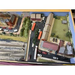 'Z' gauge continental scenic layout with folding legs, various loops of track and sidings with overhead cables, buildings including water tower, tunnels, roads with motor vehicles and figures, trees, haven with boats, backdrop diving wall hiding control units 150 x 50cm